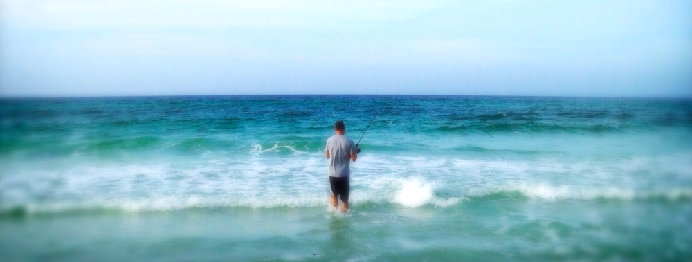 Wade-fishing for tarpon from shore in summer.