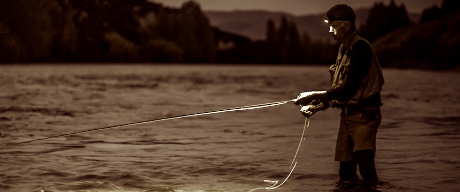 Salmon fishing on river with a Petzl headlamp.