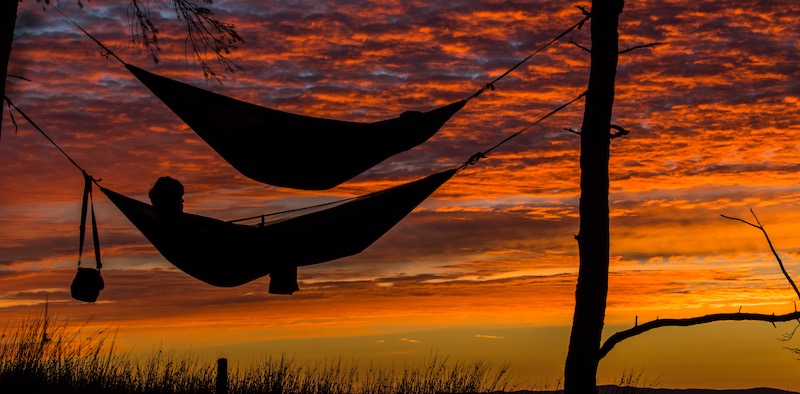 Anglers in hammocks sleeping at their favorite Florida fishing spot.