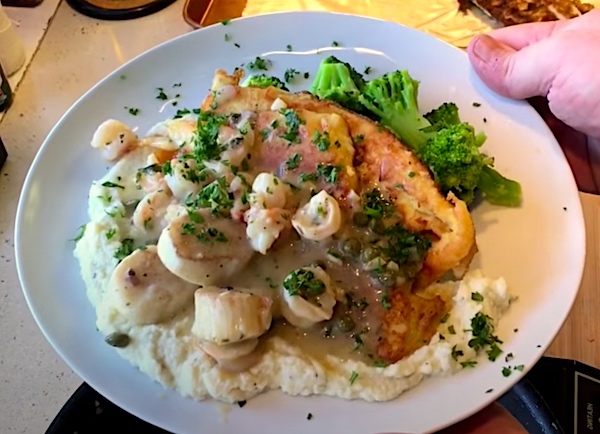 Flounder with scallops and potatoes.