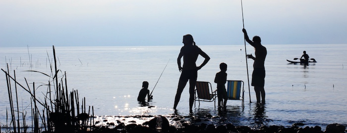 Family fishing from shore in South Florida.