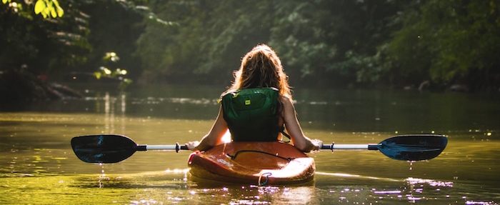 Kayaker with kayak paddle.
