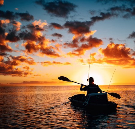 Daybreak kayak fishing on the open ocean.
