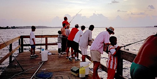 Pier fishing crowd at the end of the pier.