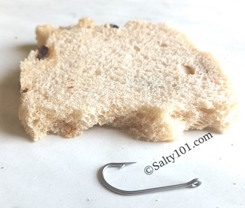 Bread and hook for fishing using bread as bait.