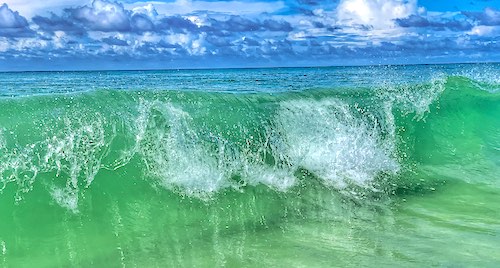 Clear green ocean water at Navarre Beach Fishing Pier near Pensacola, Florida in the the panhandle.