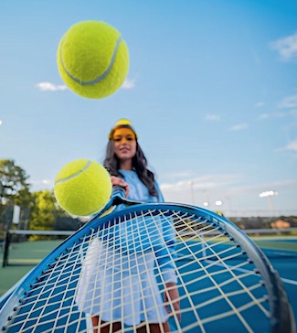 Woman with tennis hobby instead of fishing with her boyfriend.